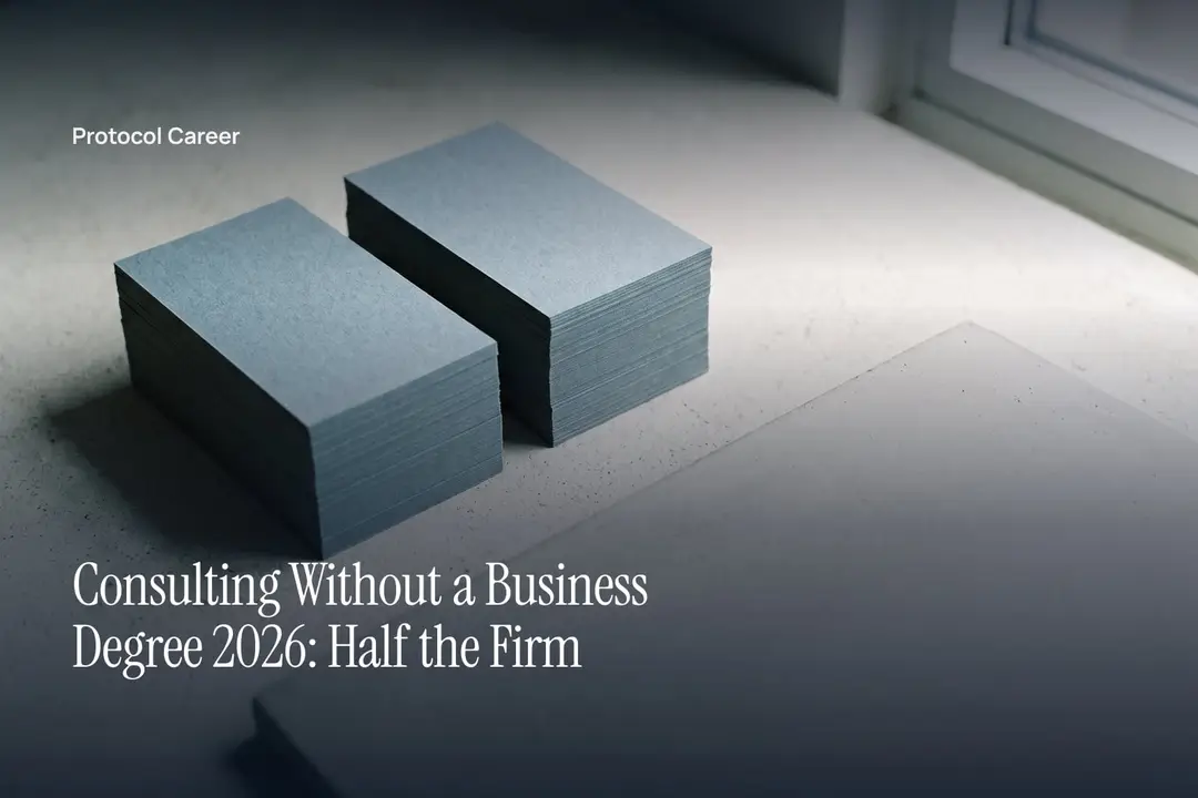 Two identical neat stacks of blank card stock resting on a plain, softly lit surface. Title: “Consulting Without a Business Degree 2026: Half the Firm”, over the Protocol Career wordmark.