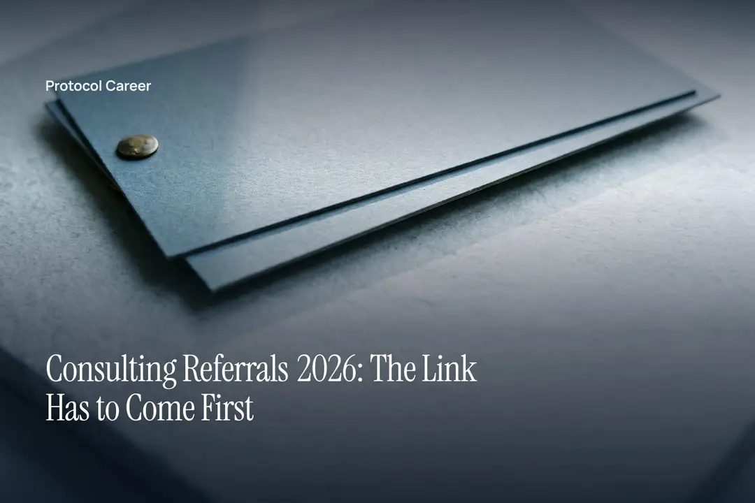 Two blank cardstock sheets pinned together with a brass fastener on a smooth grey surface. Title: “Consulting Referrals 2026: The Link Has to Come First”, over the Protocol Career wordmark.