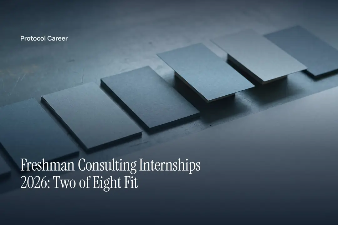 A row of eight blank grey paper slips on a slate surface, two slightly raised above the rest. Title: “Freshman Consulting Internships 2026: Two of Eight Fit”, over the Protocol Career wordmark.